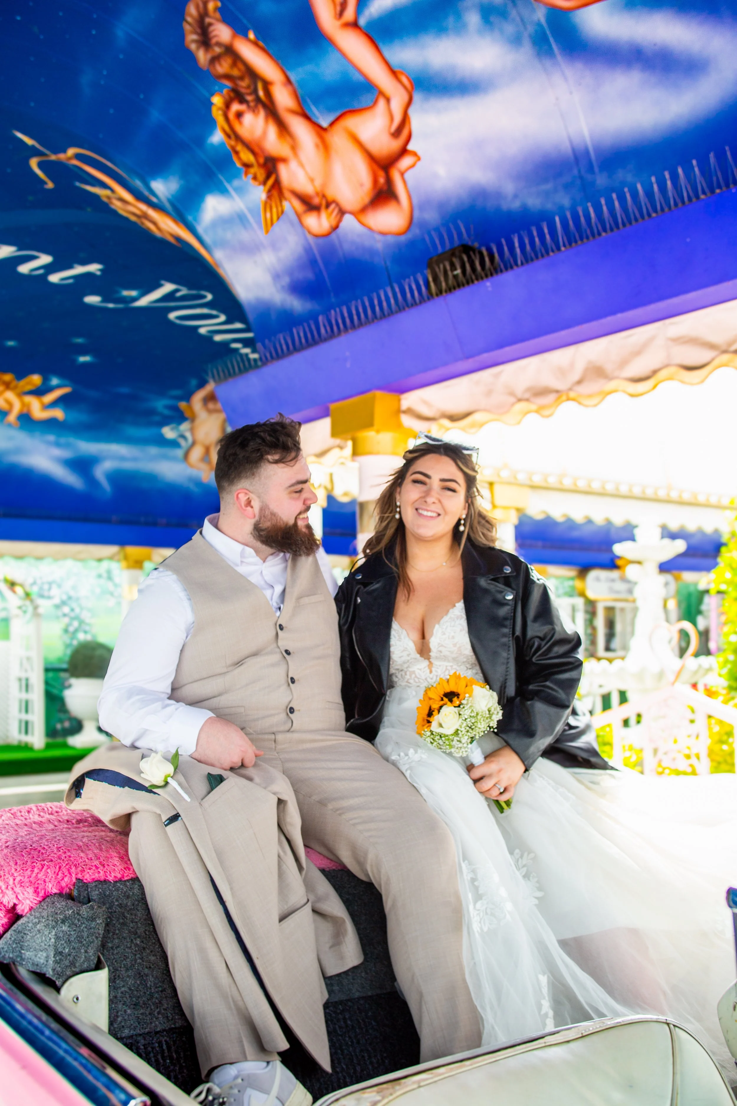 Sophie & Ben inside pink Cadillac