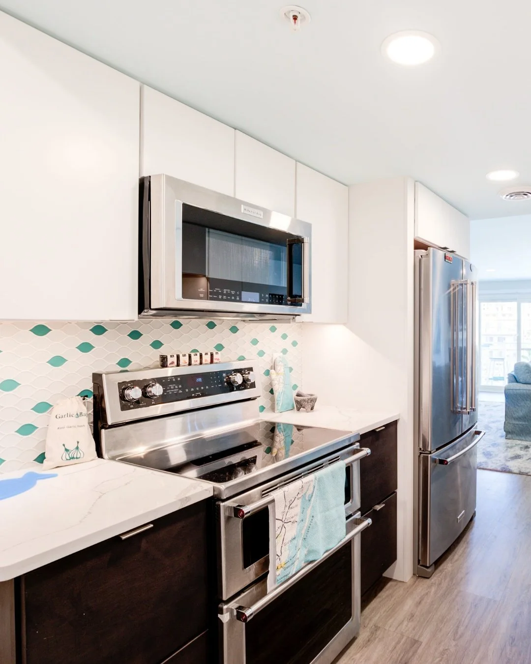 Small details make or break kitchen design. Beautiful backsplash brought down by builder-grade outlets, gorgeous cabinetry offset by bulky appliances, thoughtful finishes compromised by plastic soap bottles - these quiet design mishaps transform poli