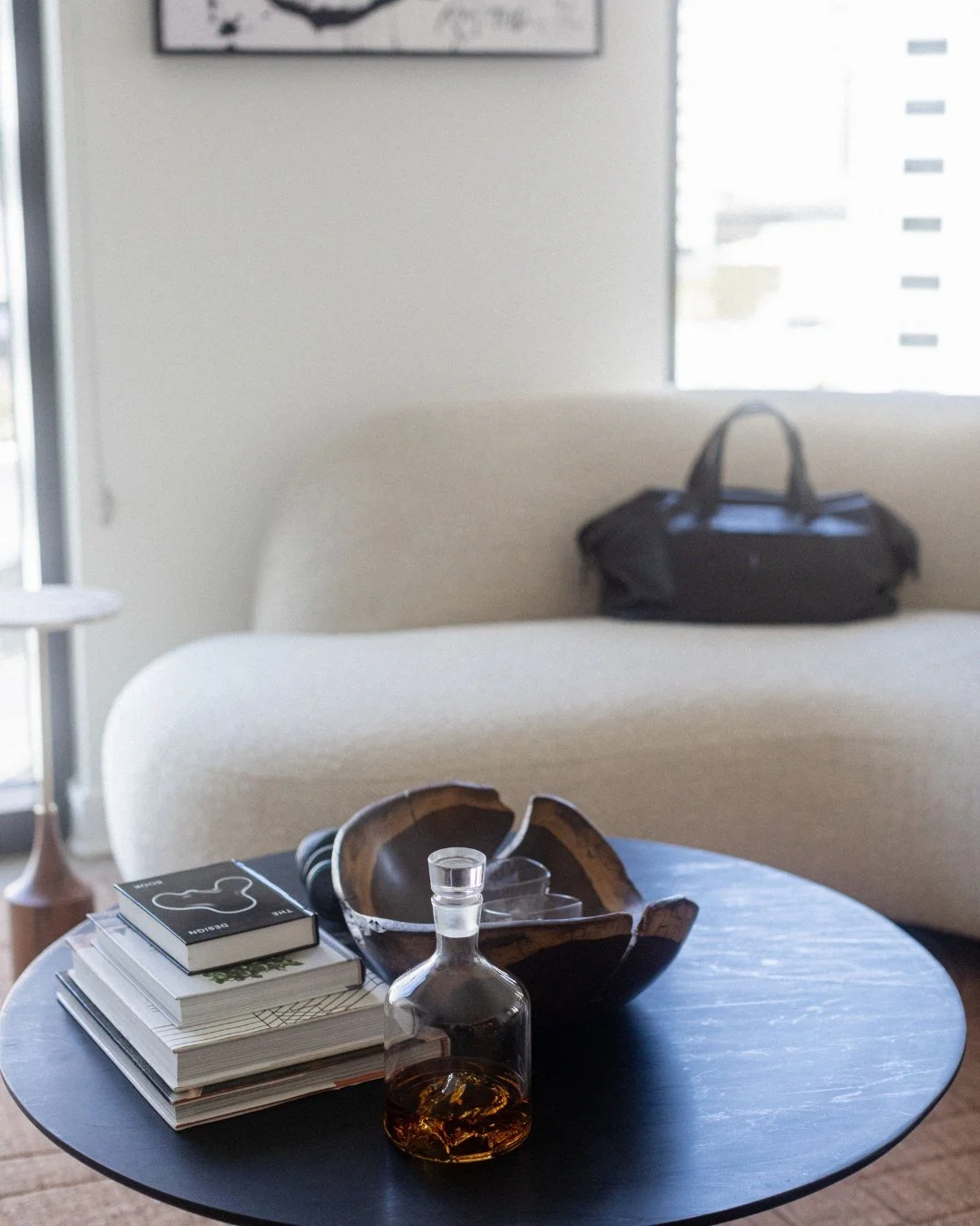 This living room is where it started to feel real.

White walls and a neutral sofa were the easy decisions. The harder one was resisting the urge to fill the space all at once, which is the mistake most people make with their condos, treating it as a