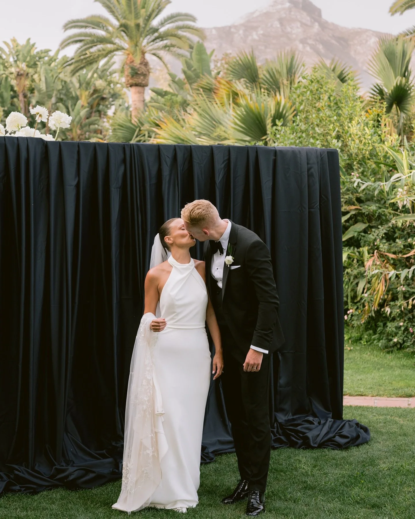 The bold graceful contrast of black and white. 
This power couple centered their day on elegance and intimacy, turning a grand celebration into something deeply personal. Their vision came to life with a mirrored ceremony space, chic decor, and the d