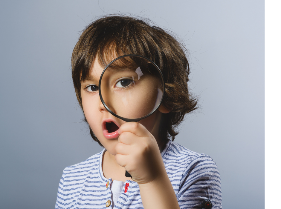 A boy with a magnifying glass