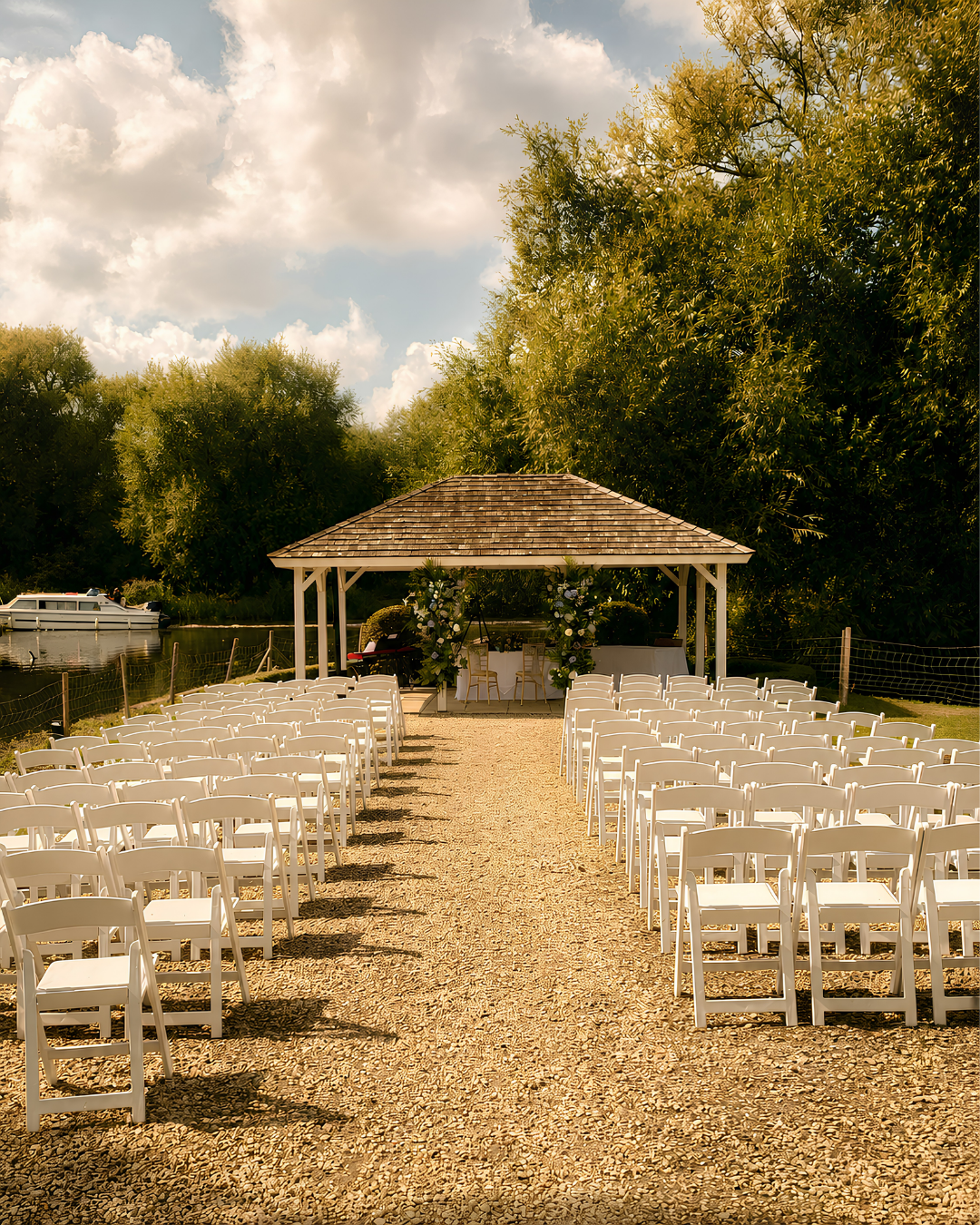 Outdoor wedding ceremony setting beside a lake, suitable for elegant live piano music and a portable white baby grand piano shell in Hampshire and Berkshire