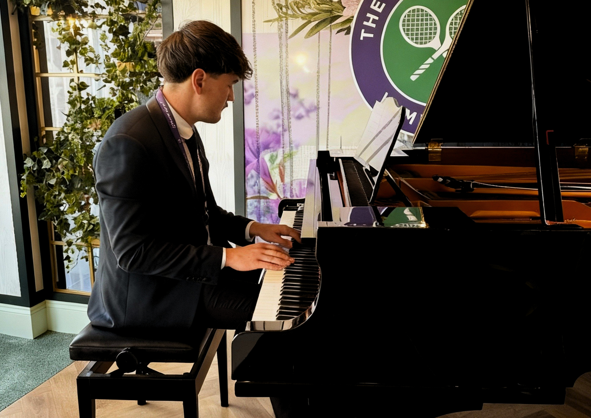 Private Piano Tuition UK student performing at the Wimbledon Championships luxury hospitality area, representing premier piano lessons in Tadley and Hampshire.