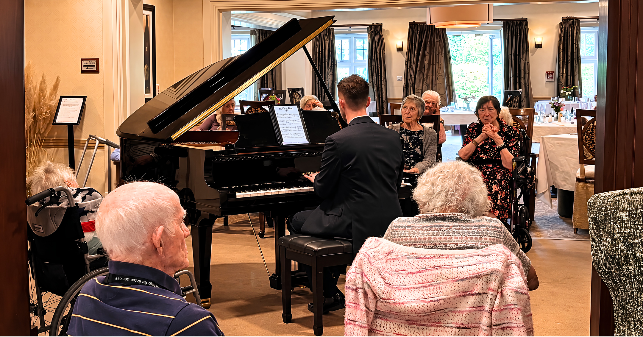 Lewis Bolland performing live piano music for residents at a care home lounge – dementia and Alzheimer's care home pianist in Berkshire and Hampshire