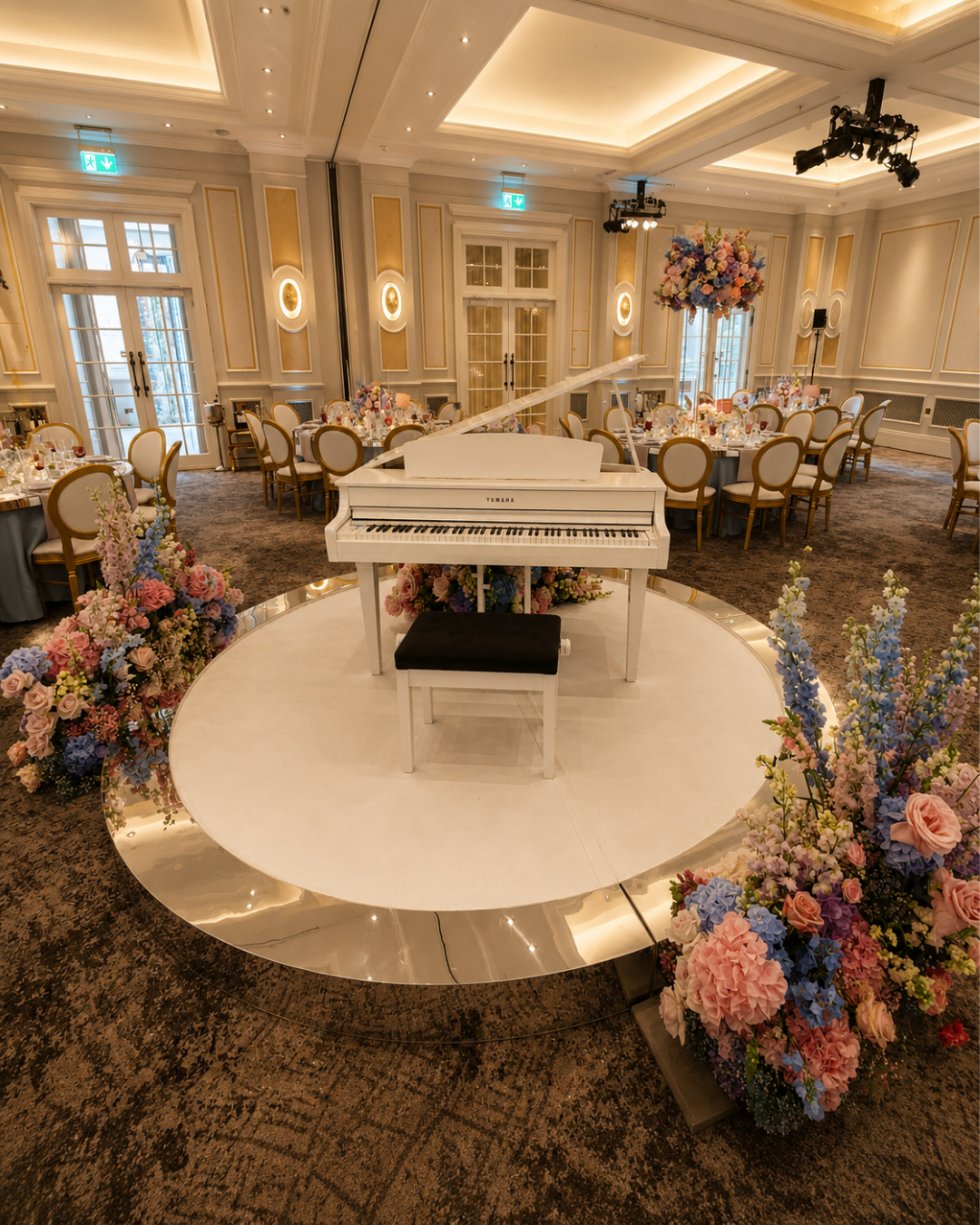 White baby grand piano shell as a centrepiece for a wedding reception – background piano music in Bristol, Bath and the South of England