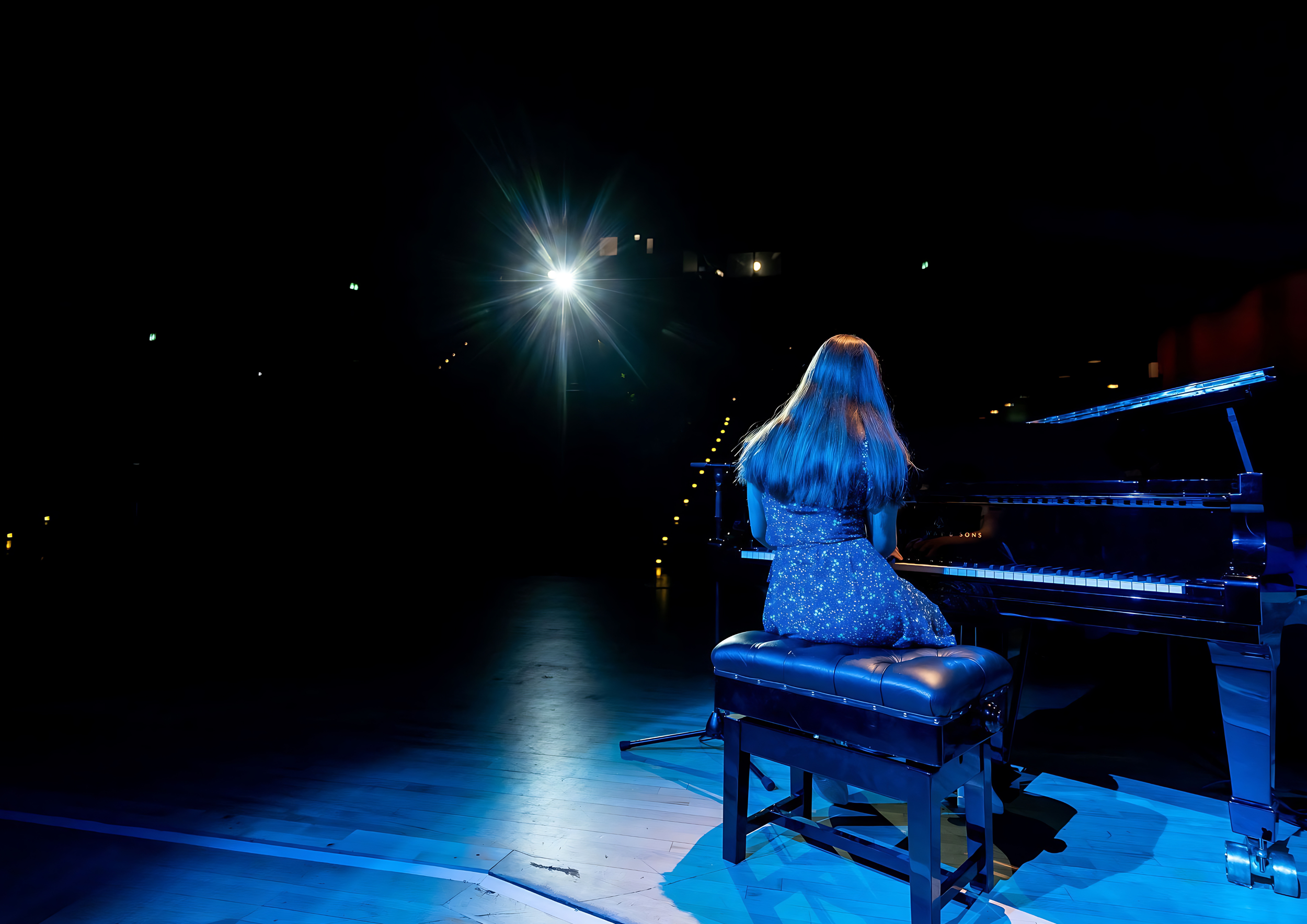 Female piano student performing on a Steinway Concert Grand at The Anvil Theatre Basingstoke, part of the professional performance opportunities at Private Piano Tuition UK.