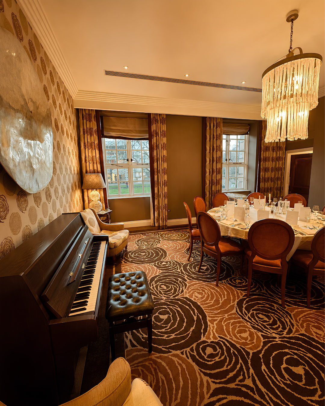 Acoustic piano in an elegant private dining room, suitable for atmospheric background piano music at weddings and events in Hampshire and Berkshire