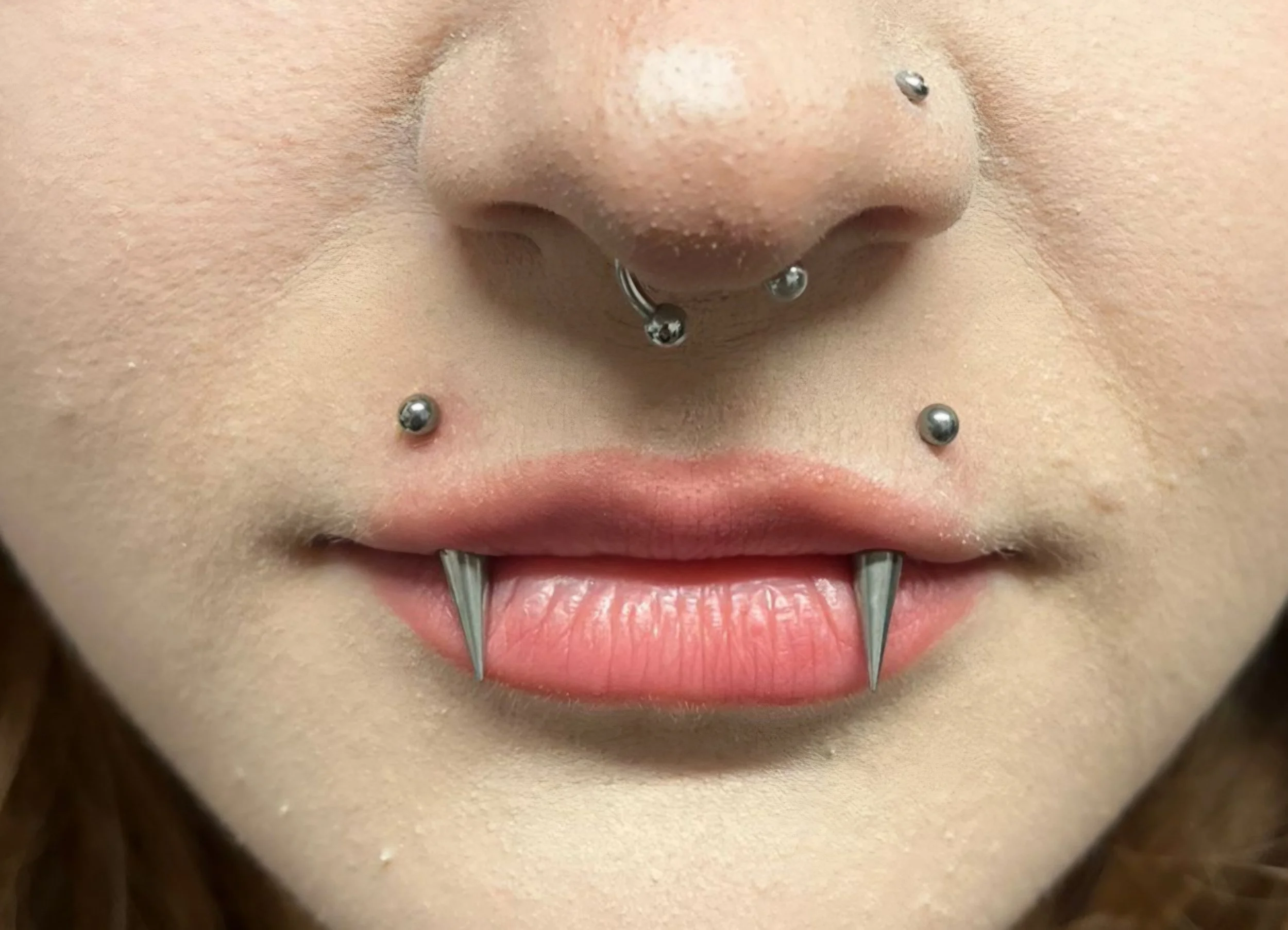 Angel fangs piercing made in Rivergate tattoo luton