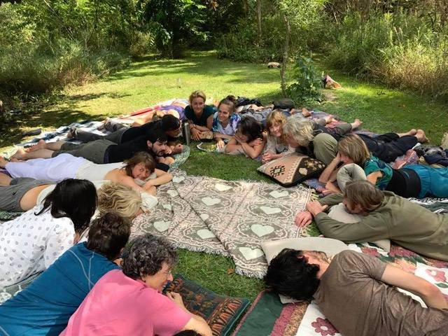 SH PEOPLE LAYING IN CIRCLE ON GROUND MED.jpg