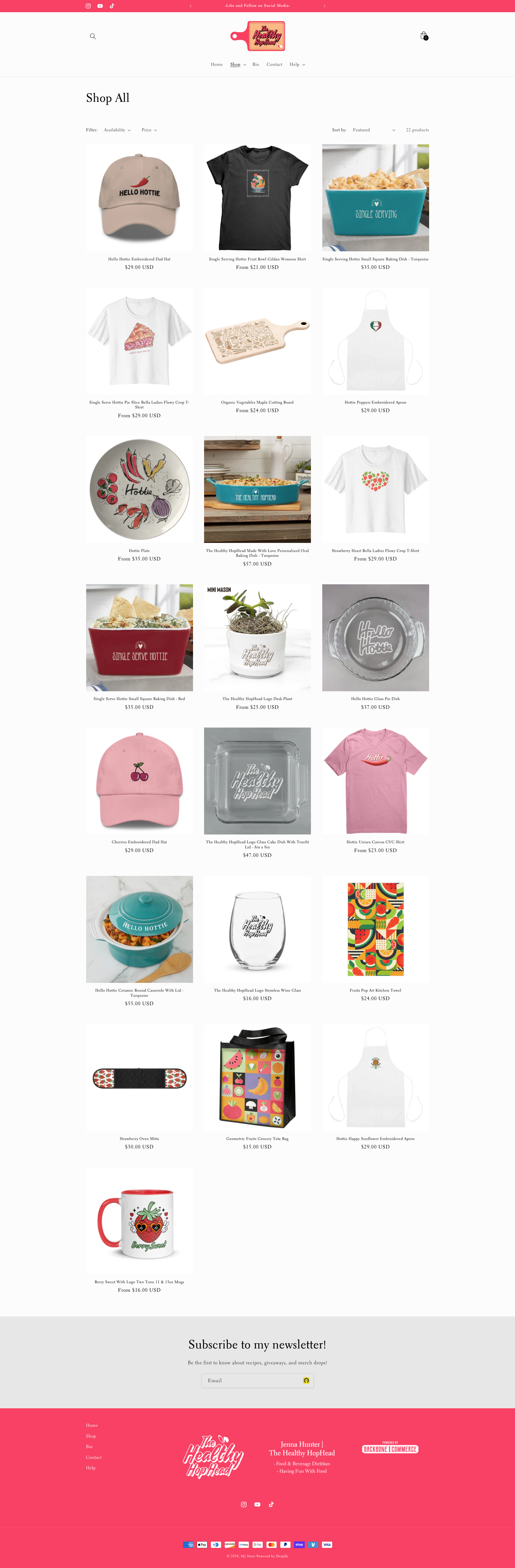 E-commerce website homepage displaying branded food and merchandise items such as hats, T-shirts, bowls, cutting boards, and decorative plants, all featuring the 'Healthy HopHead' logo and theme.
