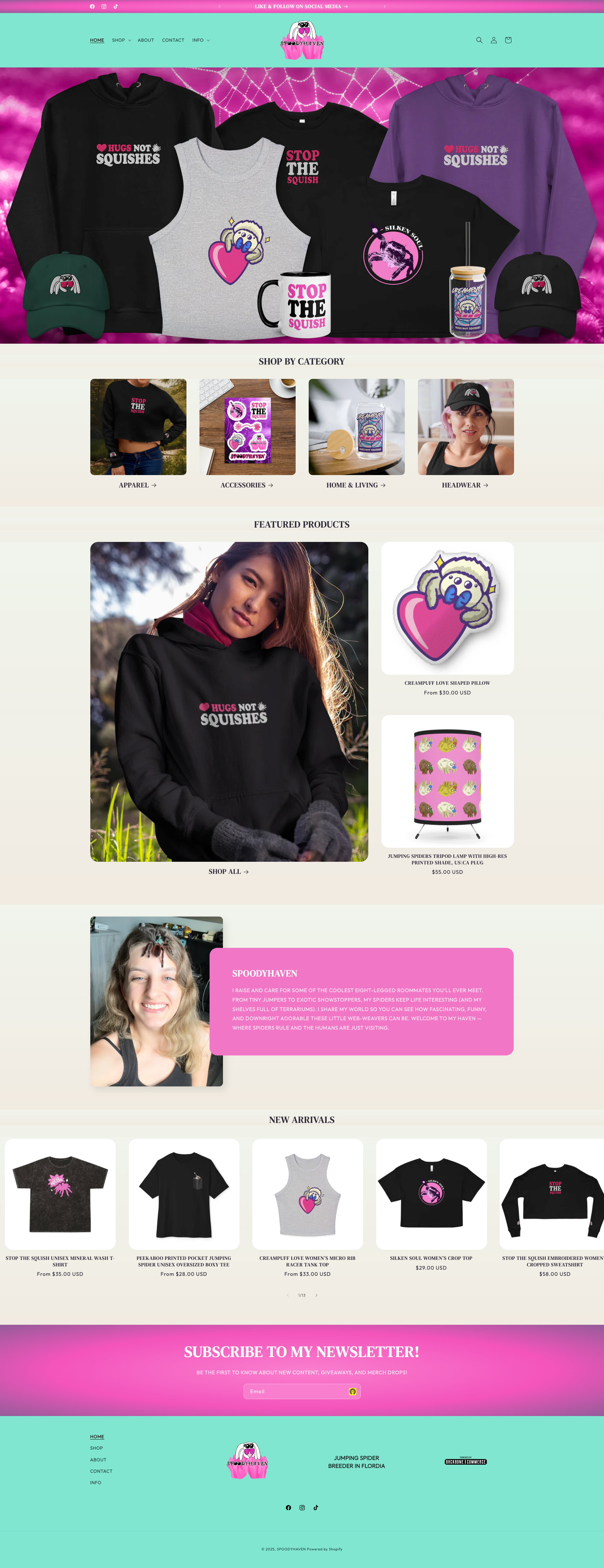 Website homepage showing various clothing and accessories with a spider web background, featuring hoodies, t-shirts, caps, stickers, and a lamp from a brand called SPOODYHAVEN.