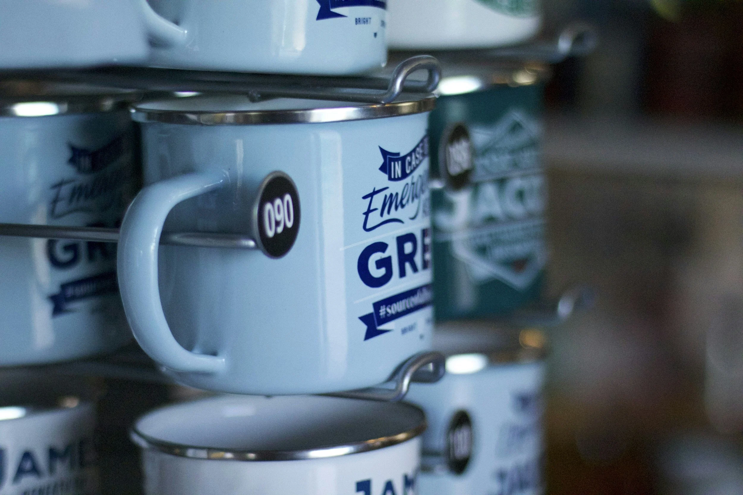 a blue merchandise mug on a rack