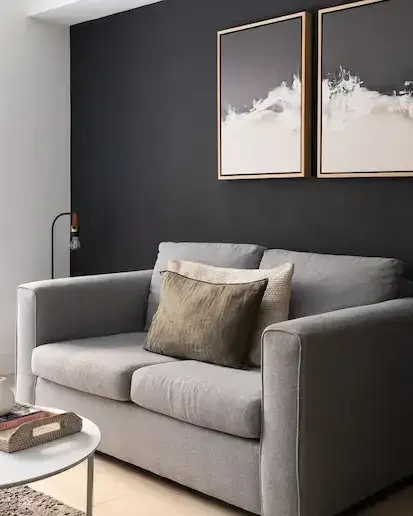 Grey sofa in Oxford Circus Apartments