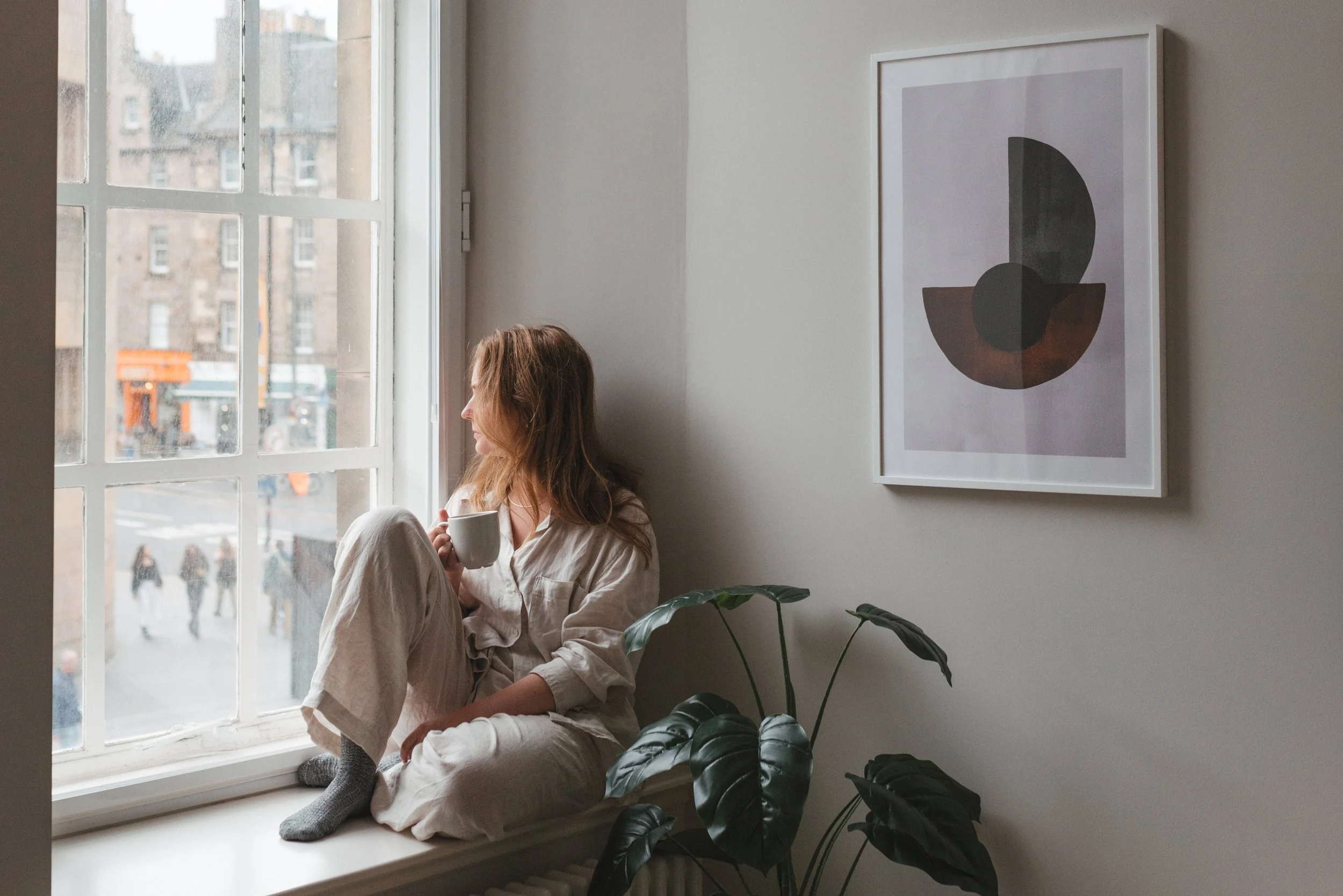 Girl in an Apartment Window