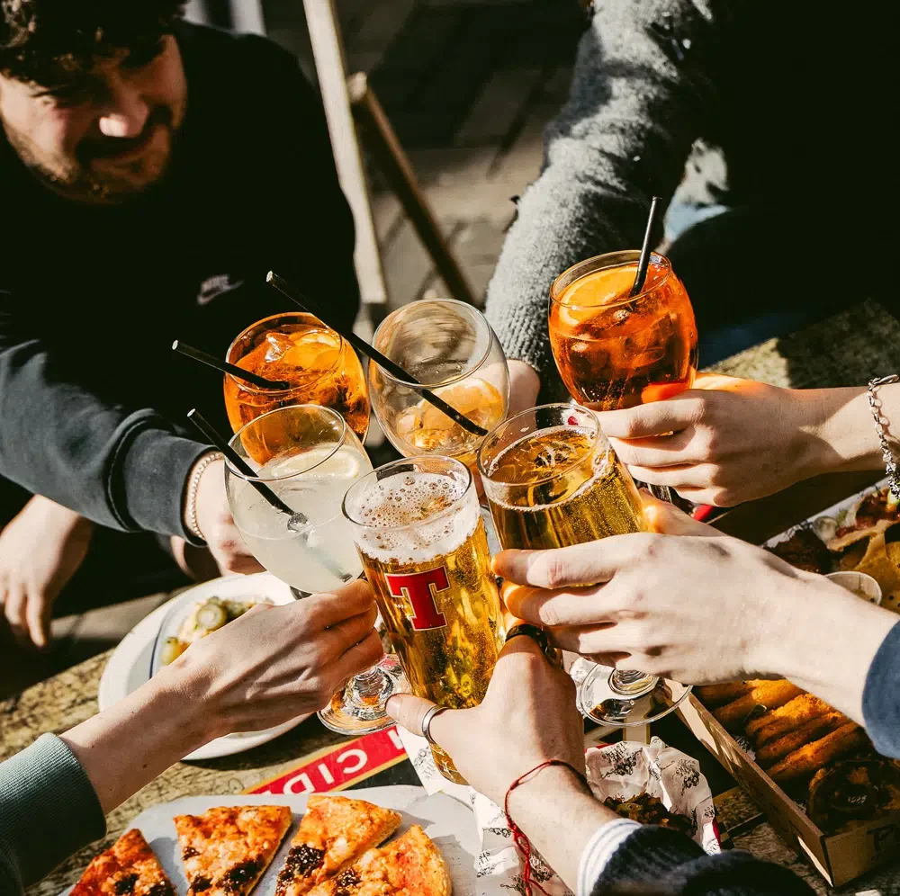 Drinks being cheers'd in a pub
