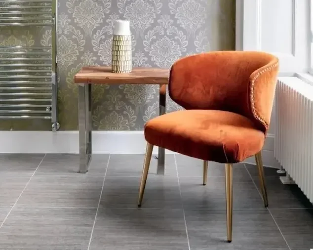 Orange chair in Haymarket Apartments bathroom