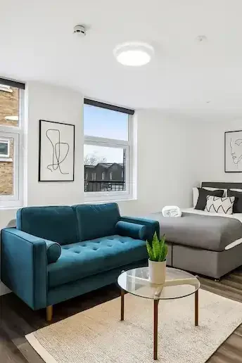 Sutherland Apartments living space and bed