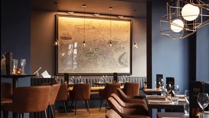 A restaurant with brown chairs.
