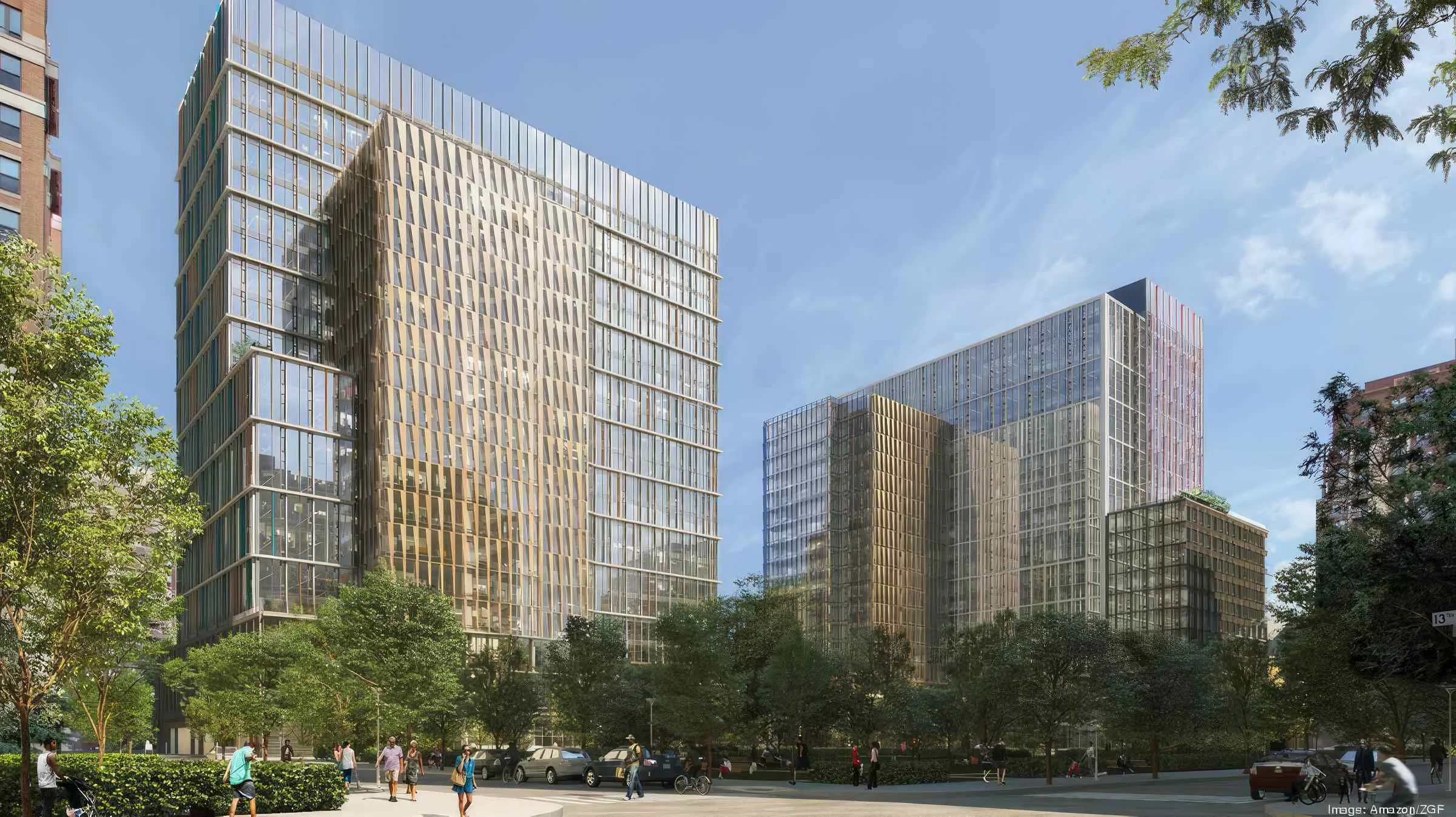Modern glass skyscrapers surrounded by green trees and a busy city street with people walking and cars parked.