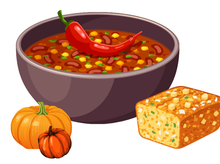 A bowl of chili with a red chili pepper on top, accompanied by pumpkins and a block of cornbread.