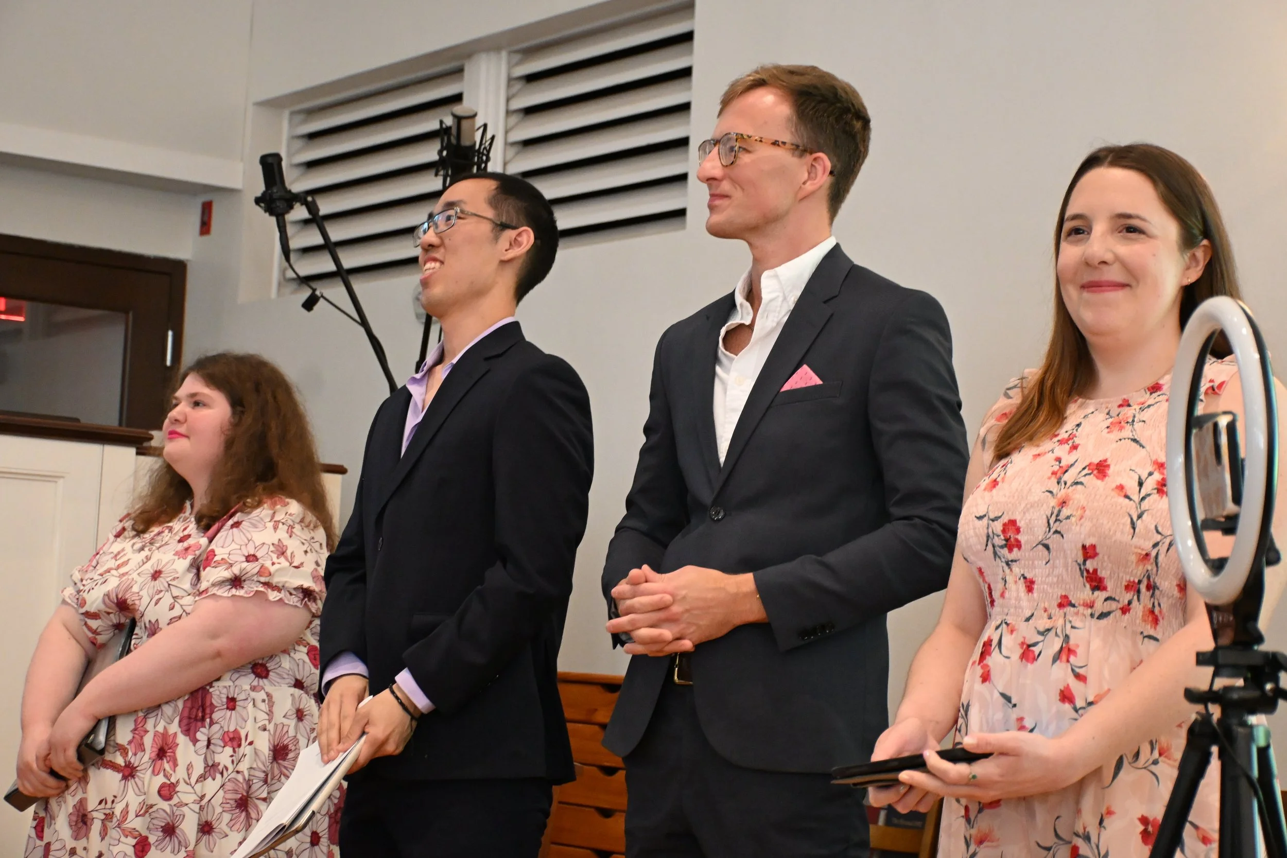 Four singers at a Circle of Friends concert.