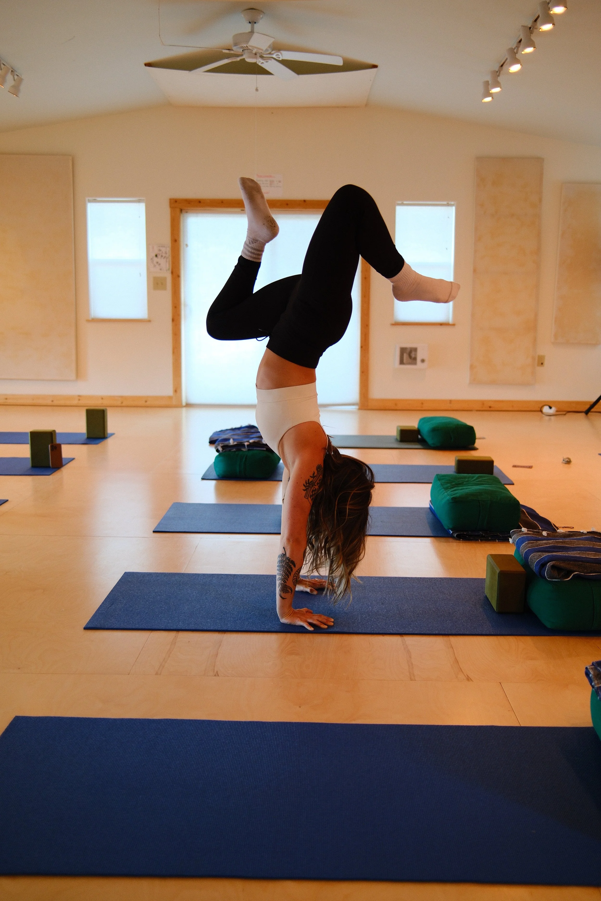 handstand in yoga studio in taos new mexico