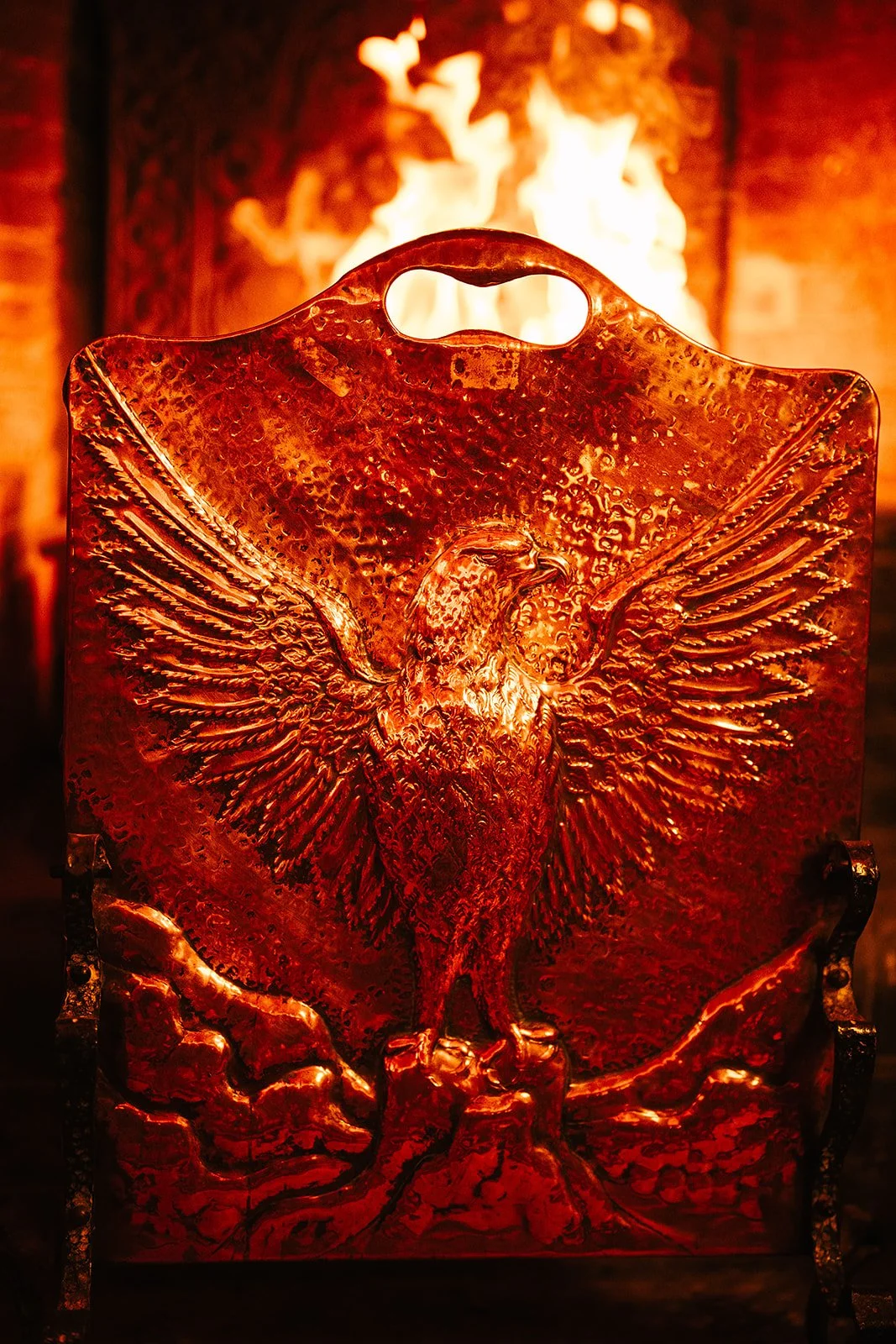 Image of a fireguard in the design of a phoenix