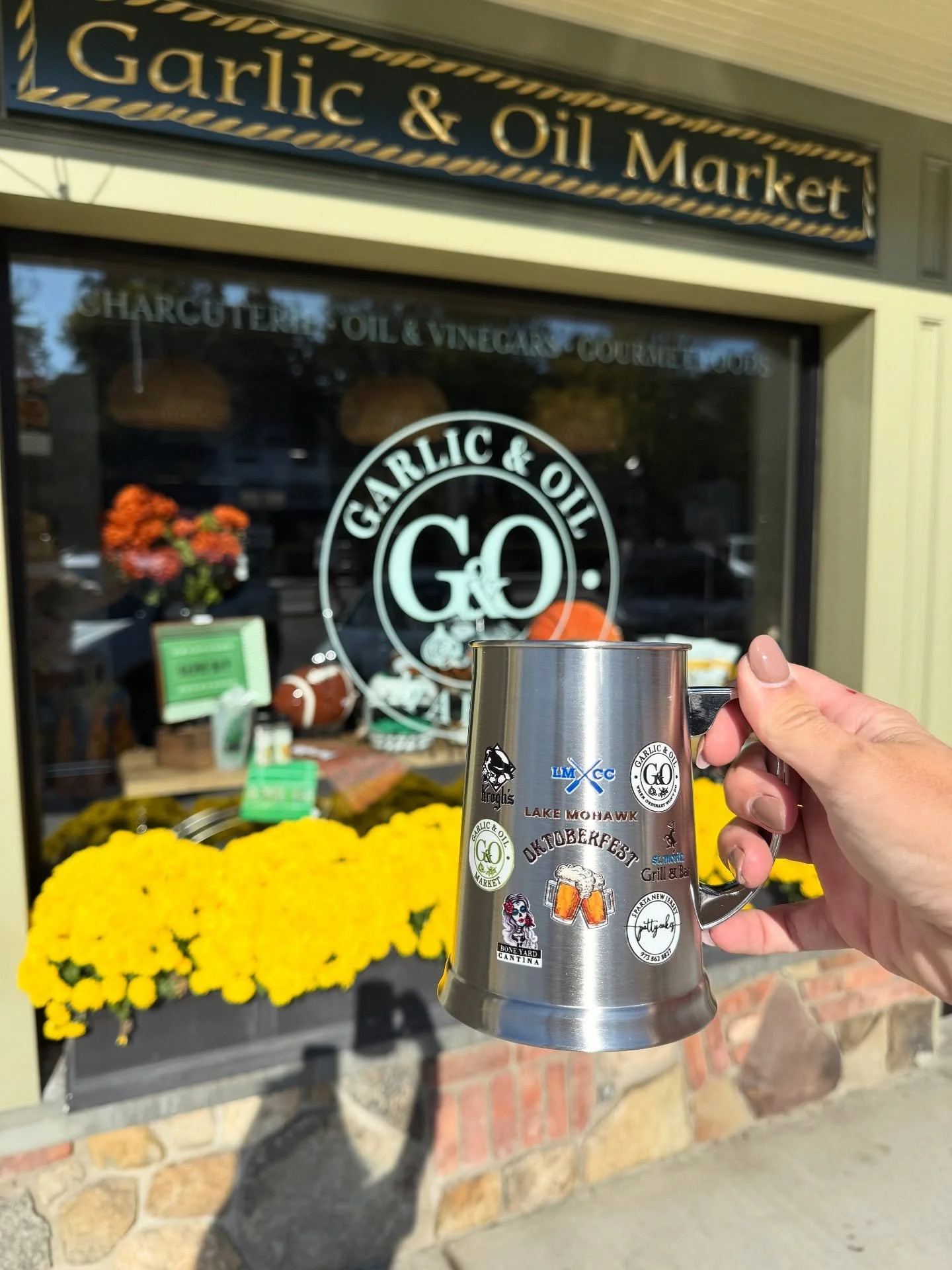 Time to raise a glass to Oktoberfest!! Come in to Garlic &amp; Oil Home and Garlic &amp; Oil Market to buy your official LMCC Steins!