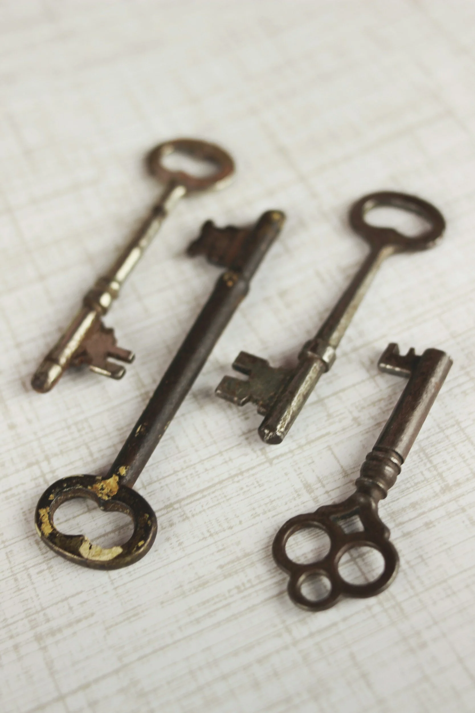 A photograph of a small collection of antique keys