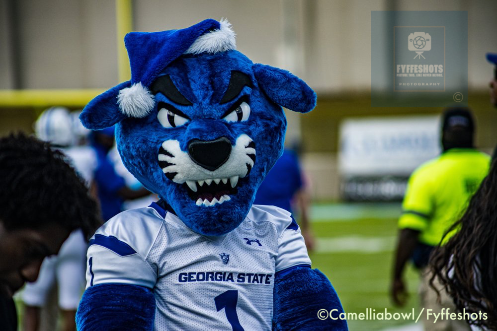 Georgia State Panthers football mascot wearing a Santa hat and No. 1 jersey at a game