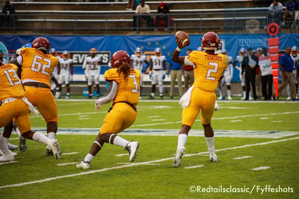 Tuskegee Golden Tigers football quarterback throws a pass during a game