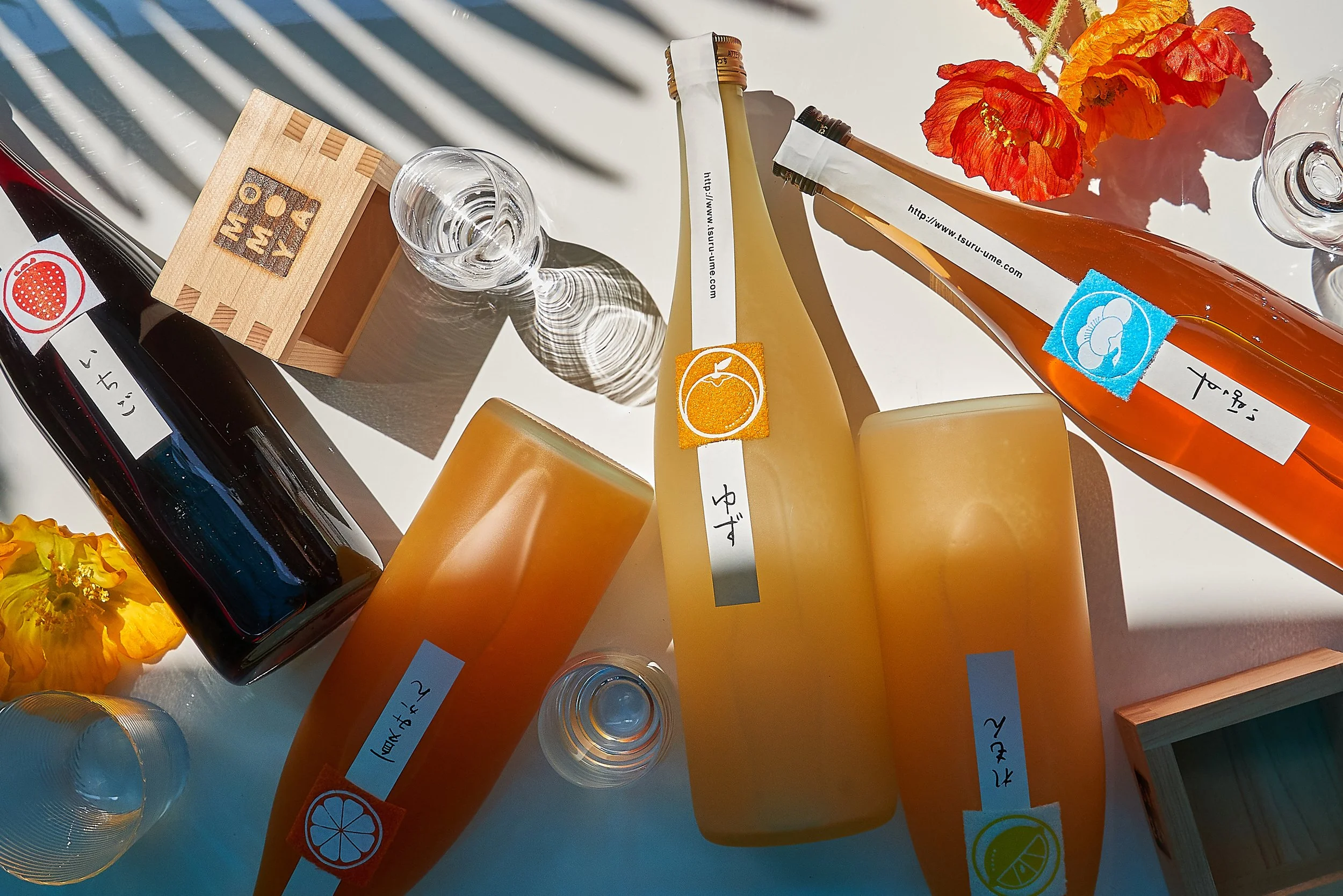 Styled sake bottles, photographed at Momoya Soho