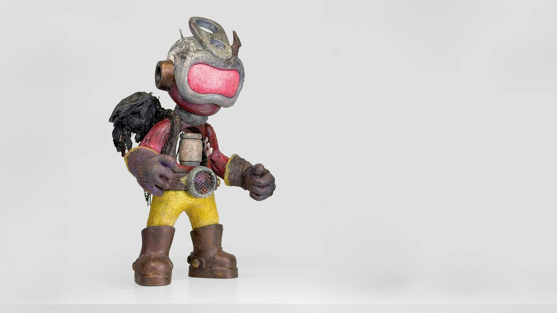 Adventurer character art toy wearing goggles, a breathing mask and a weathered outfit.