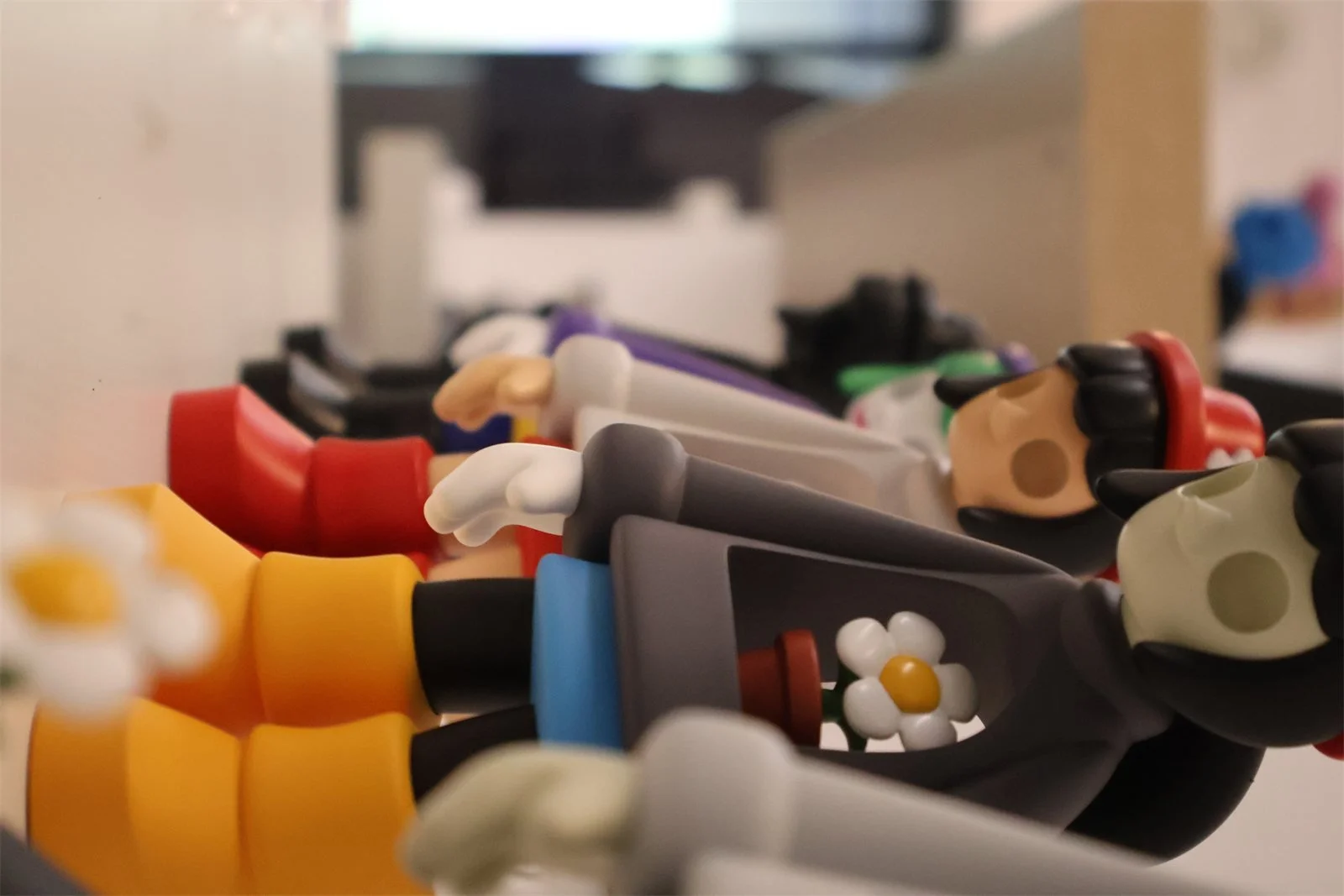 aFinished Atom Toys void figures lying on a shelf in the studio in Espoo, Finland