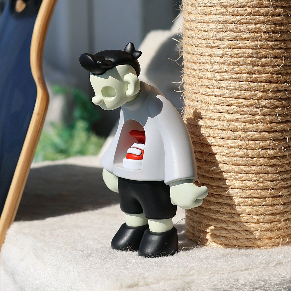 Joy Boy limited edition designer art toy in off-white, front view, highlighting the clean resin contours and minimalist design from the Joy Boy series