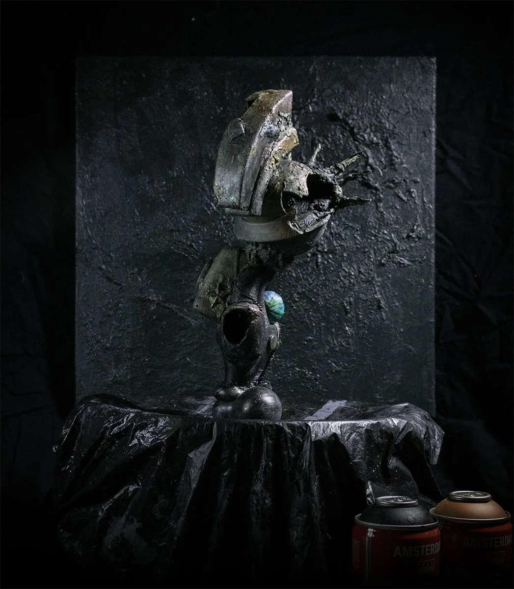 Liberty Lamenting the World designer art toy angled view showing fractured helmet and worn textures.