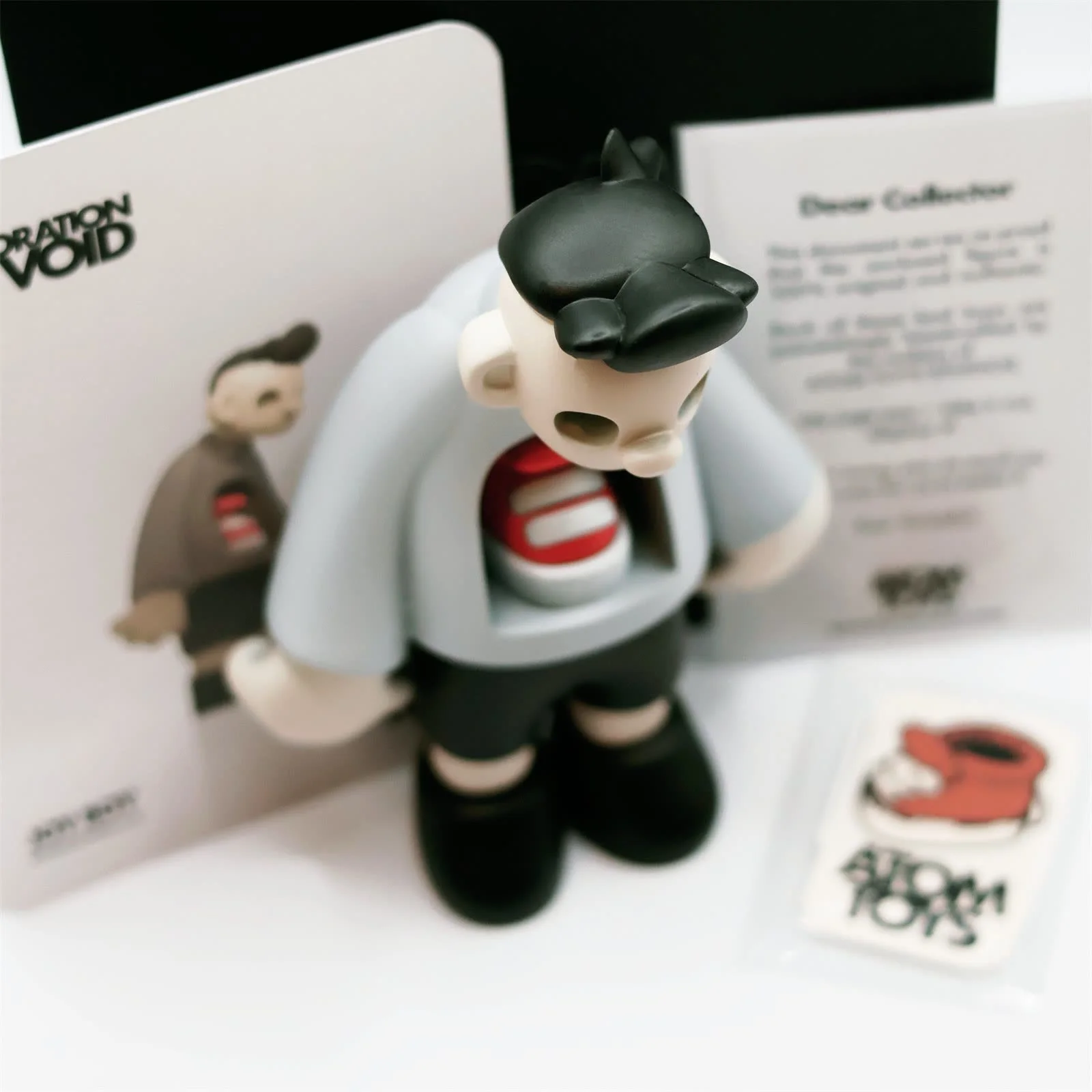 Joy Boy art toy with its numbered Exploration of Void collector certificate