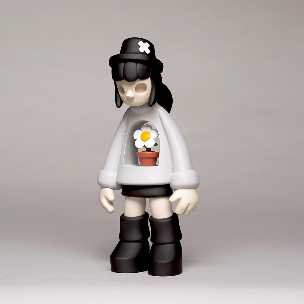 Miss Bliss limited edition designer art toy in grey, showcasing a 3/4 side view, with intricate resin details and a smooth finish from the Exploration of Void series.