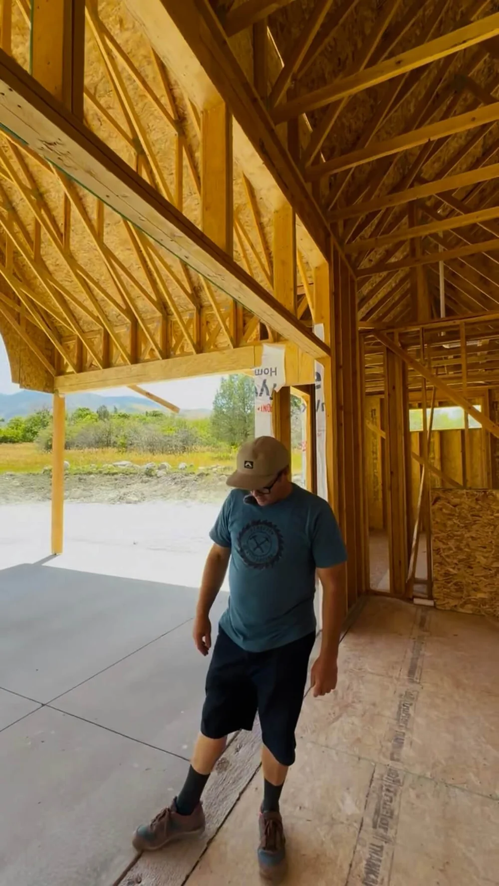 Covered zero-step patio entrance under exposed trusses on a Bergeson Construction home in Cache Valley, Utah