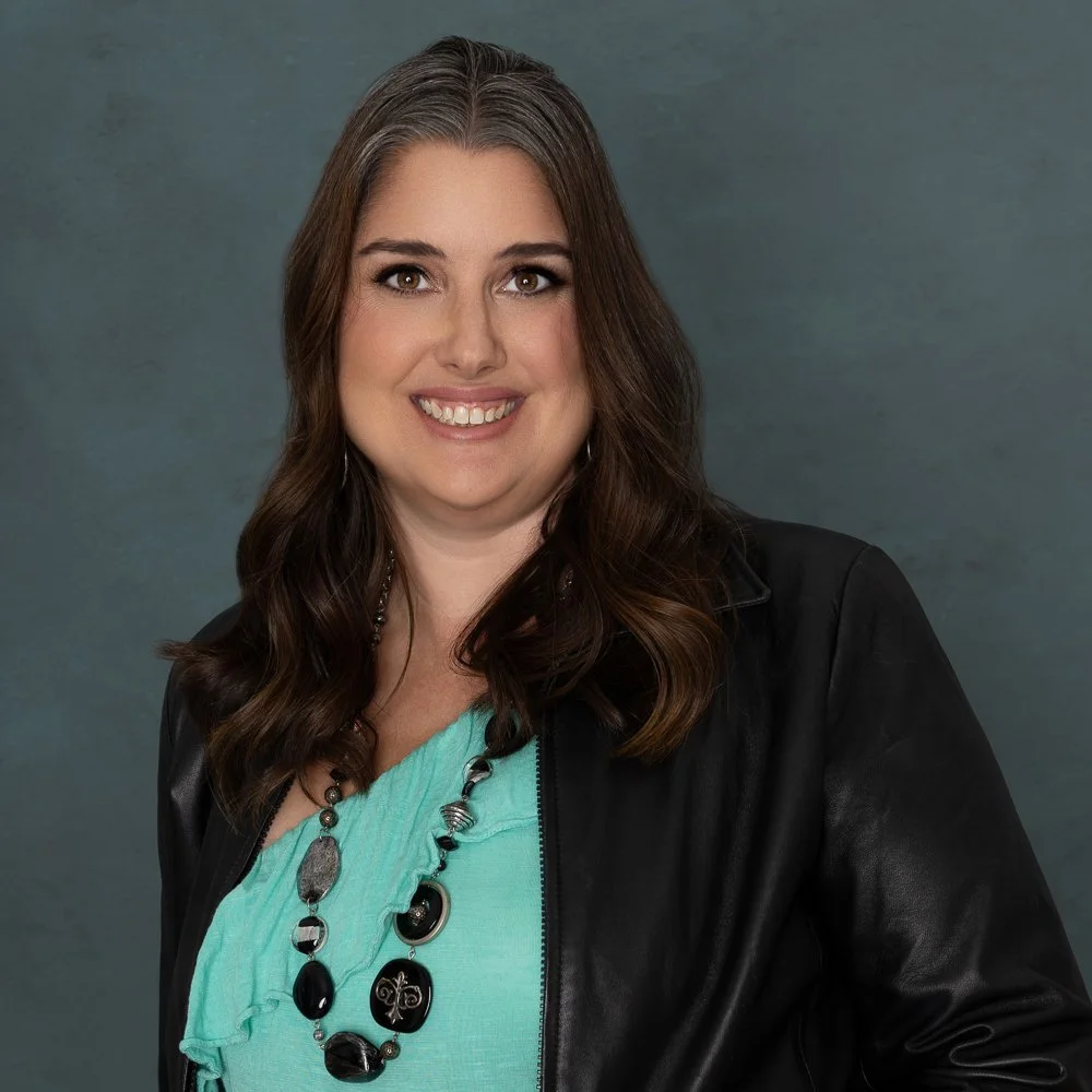Picture of woman with turquoise shirt - Amanda Rowe