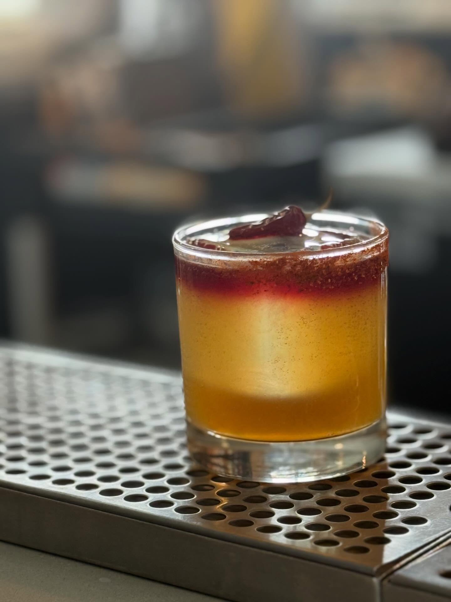 Our new cocktail, Tierra Rojo, brings together smooth Mexican whiskey with the fiery warmth of chile liqueur, balanced by fresh lime juice and a touch of agave sweetness. A rich red wine float adds depth, while the perfect habanero garnish dried from