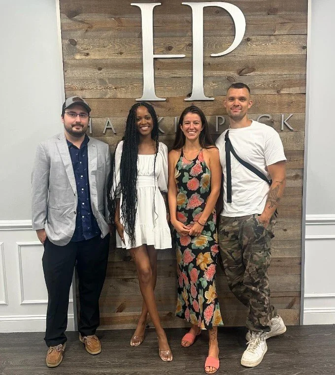 Homebuyers celebrating at closing with Realtor Sia Small after purchasing a home in North Carolina.