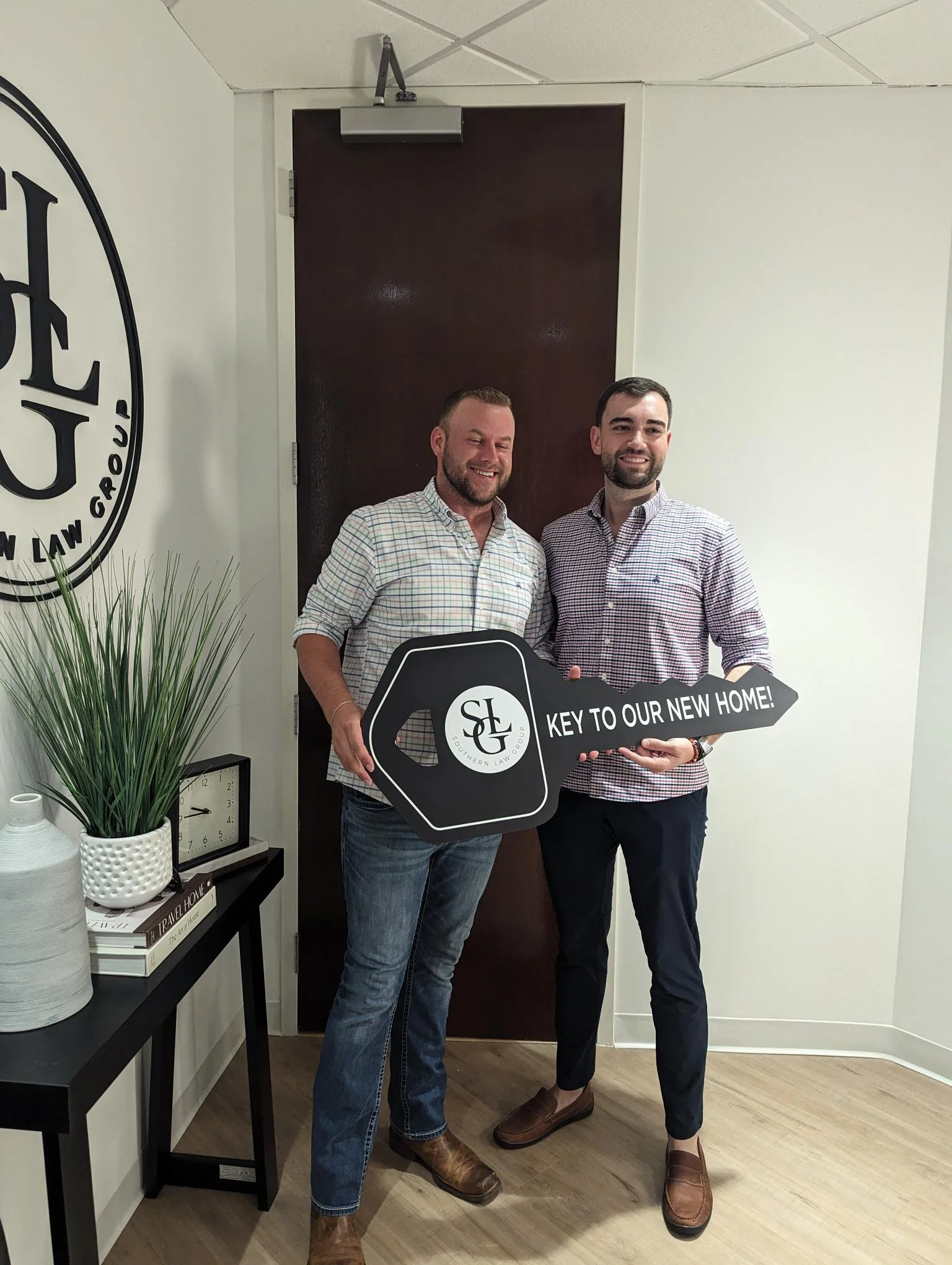 Homebuyer celebrating at closing after purchasing a new home with Carolina Home Financing.