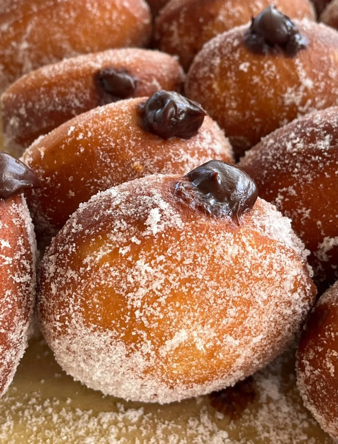 one of our favorite parts of fall is the transition towards heavier, richer flavors 🔥 

chocolate tahini cake, s&rsquo;mores cream puffs, chocolate crunch cookies.. and now these dark chocolate burnt coconut malasadas that have been living rent free