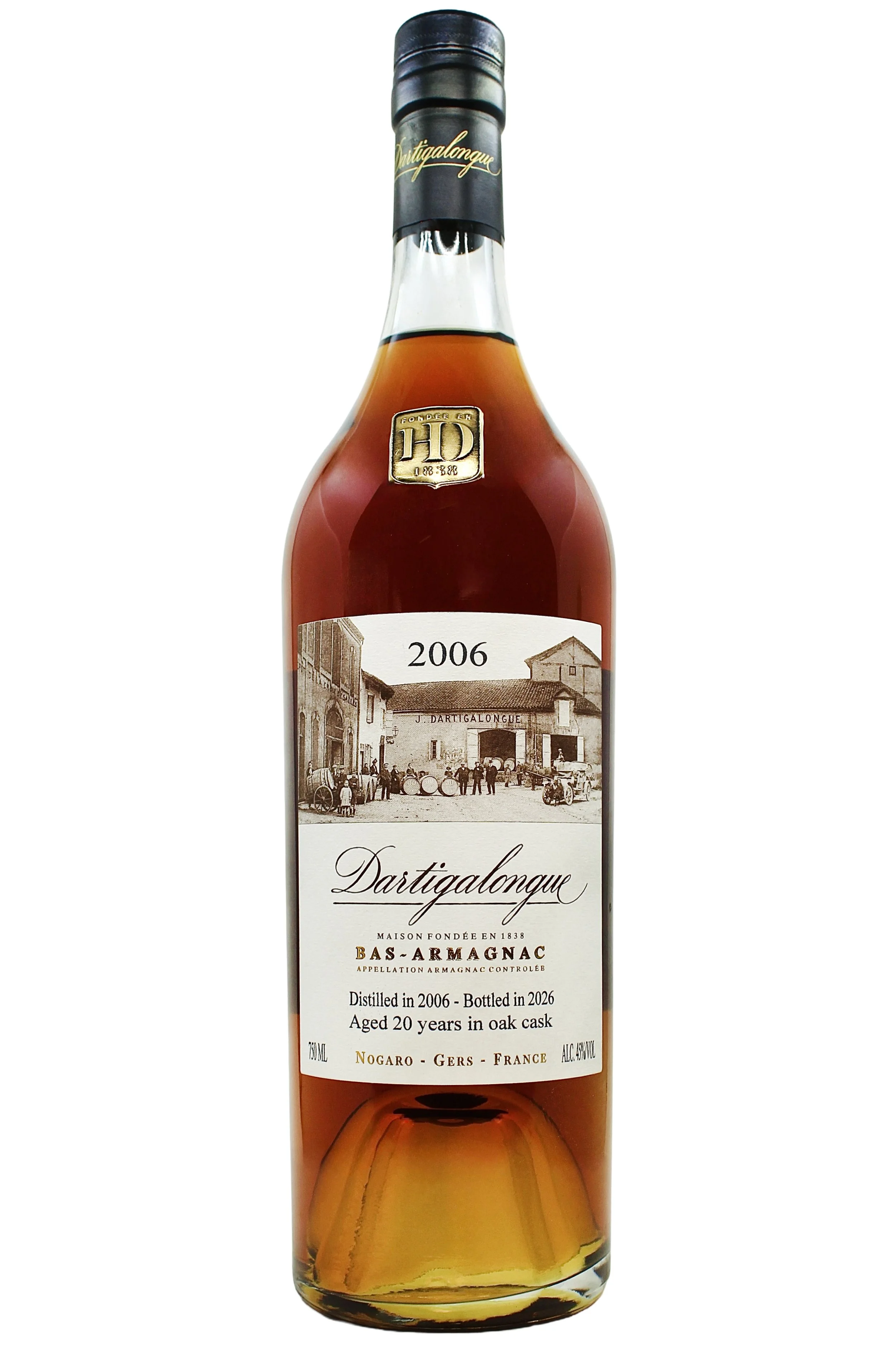 Close up on Dartigalongue Bas Armagnac 2006 vintage with an antique photo of the distillery's forecourt and gold seal on the neck. 