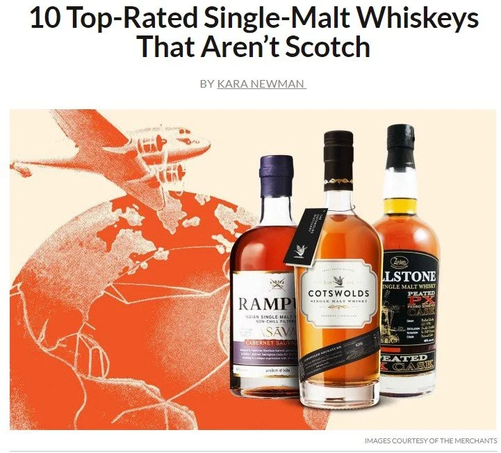Three whisky bottles next to orange illustration of an airplane flying over the Earth