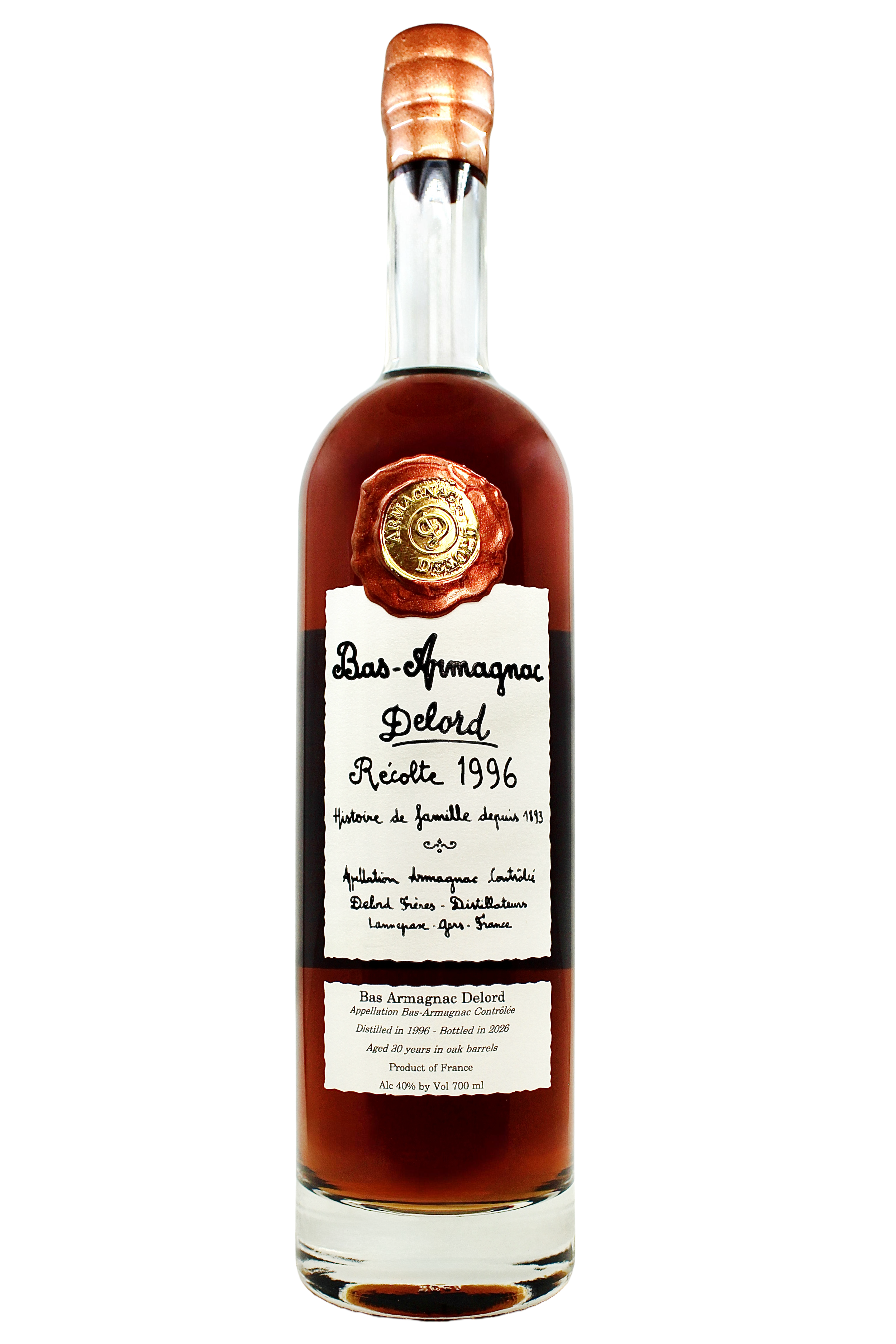 Close up on Delord Bas Armagnac 1996 vintage with an antique hand-written style label and copper wax seal.