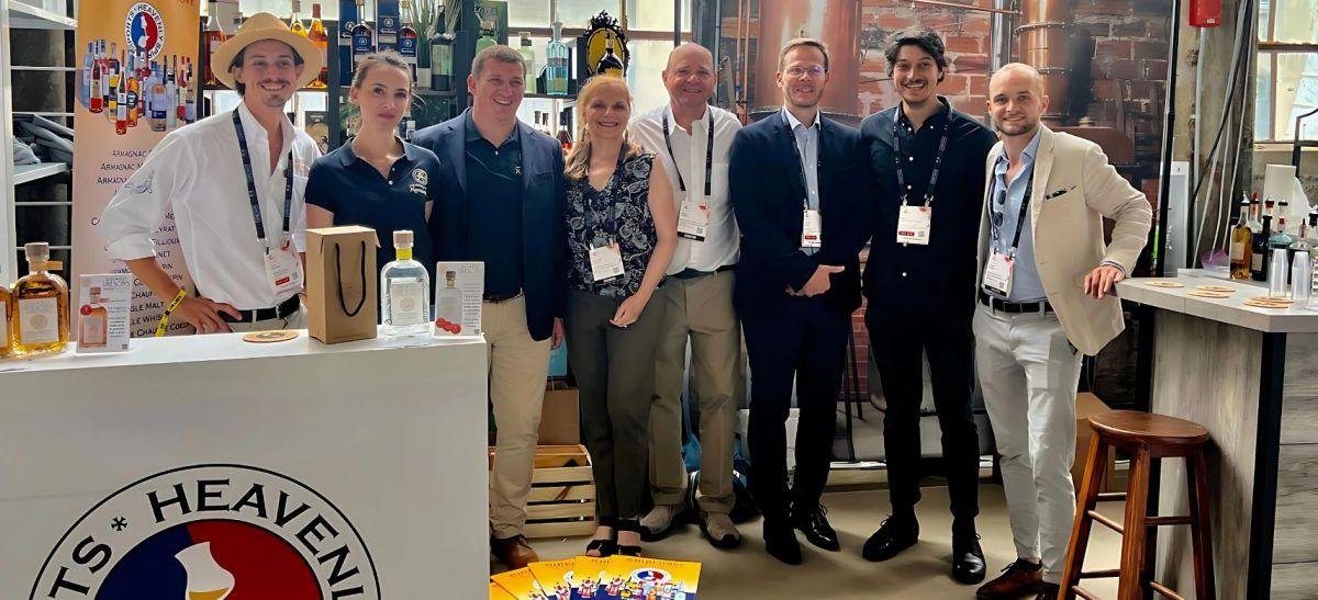 Group of people standing in a trade show booth