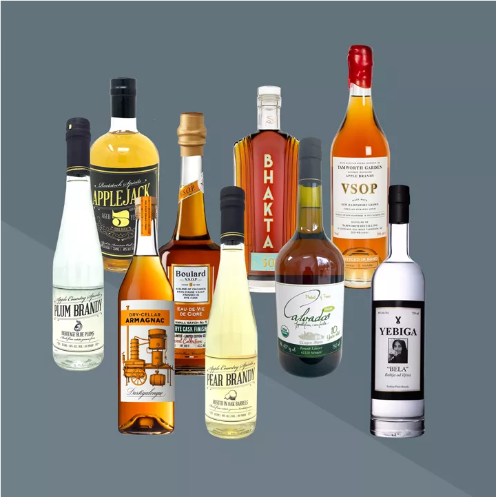 A collections of liquor bottles on a grey background
