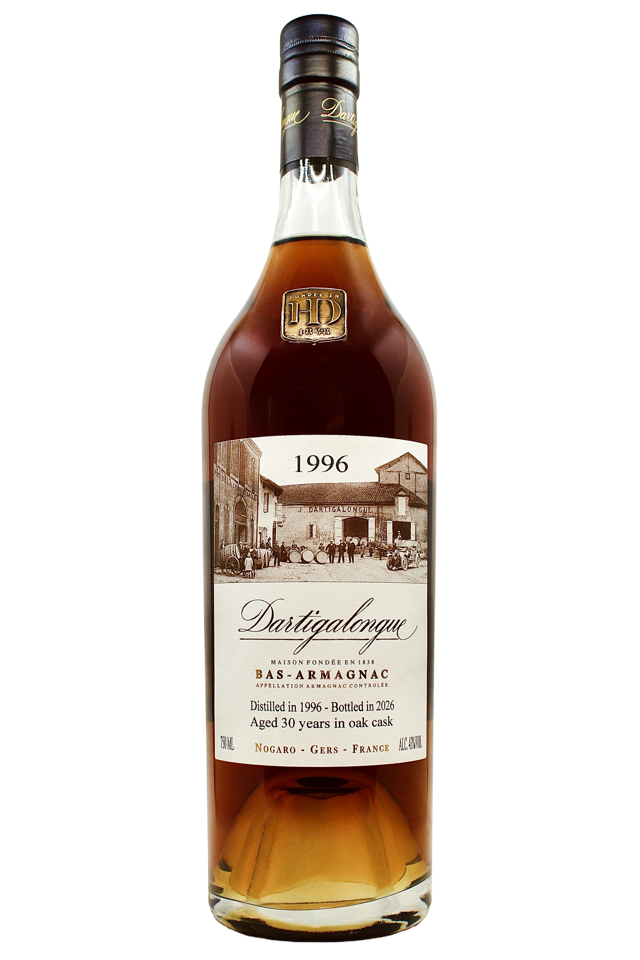 Close up on Dartigalongue Bas Armagnac 1996 vintage with an antique photo of the distillery's forecourt and gold seal on the neck. 